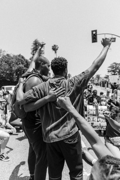 Build greater empathy Two men shoulder to shoulder