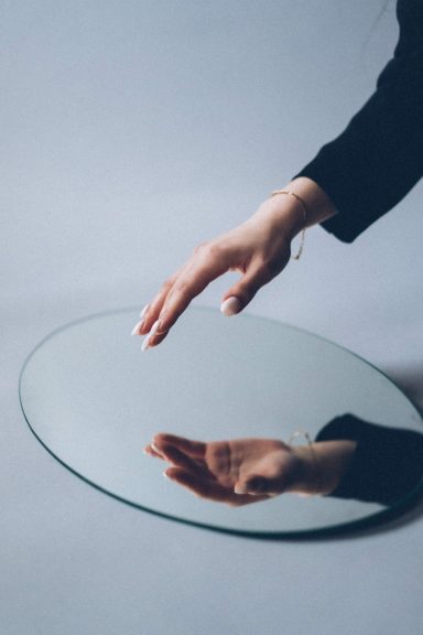 Create meaning Hand infront of mirror